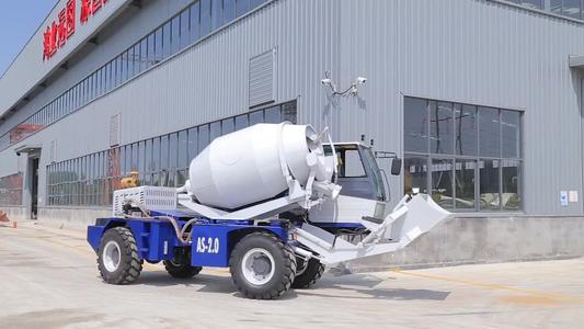 Self loading and weighing concrete mixers 